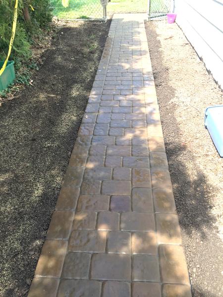 dark colored cobblestone walkway